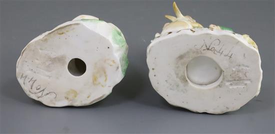 A pair of Rockingham porcelain groups of a boy feeding a rabbit and a girl seated with a lamb, c.1830, h. 14cm and 10.5cm, some faults